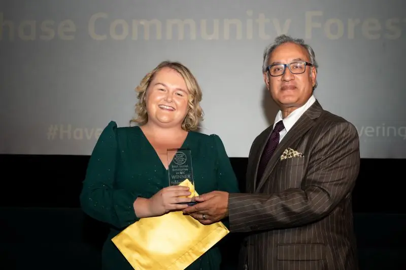 Noorzaman presents Thames Chase Community Trust with their award.