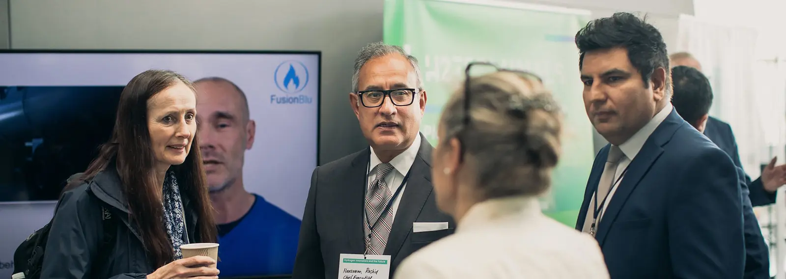A group of four people chatting at the event.