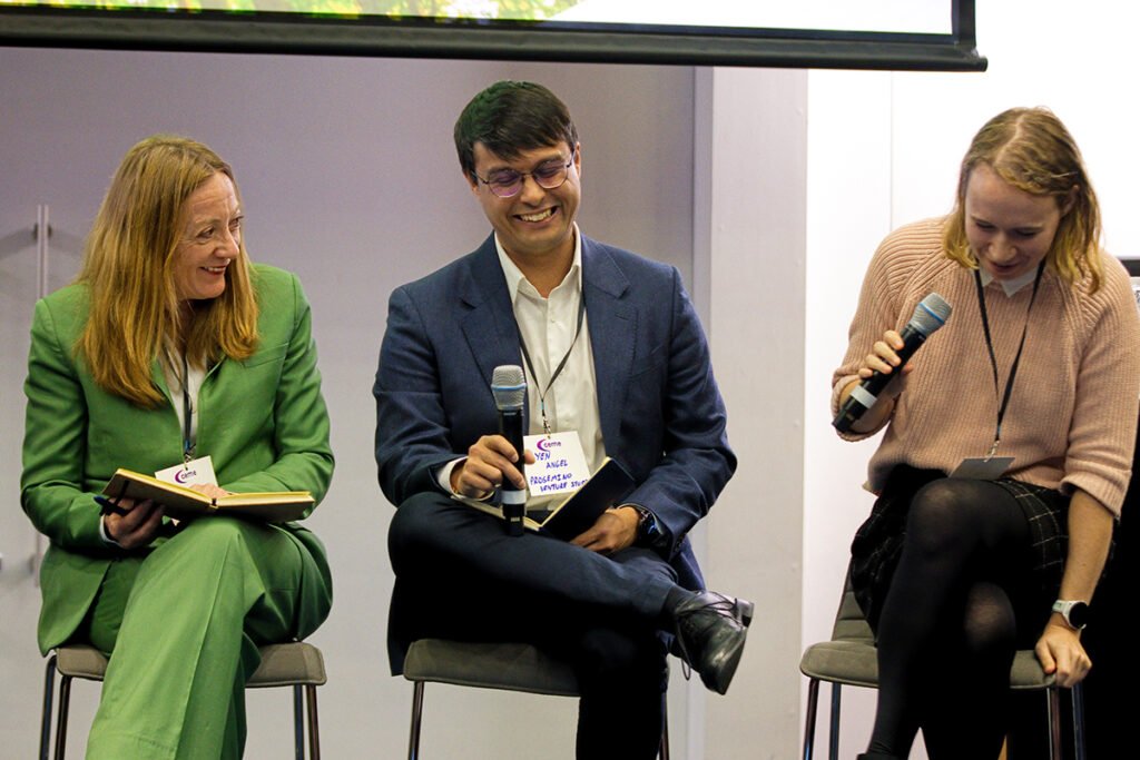 Panelists laugh at a joke.