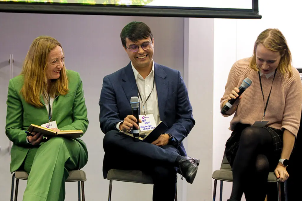 Panelists laugh at a joke.